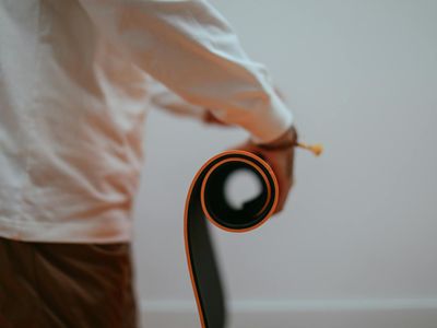 Close up of a rolled yoga mat on floor.
