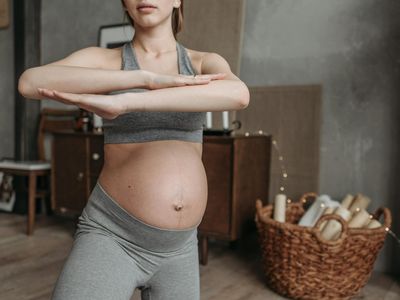 Hand stretching towards the sky during exercise.